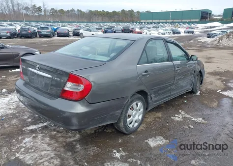 2004 Toyota Camry Le z USA, uszkodzony, nr VIN JTDBE32K440252303